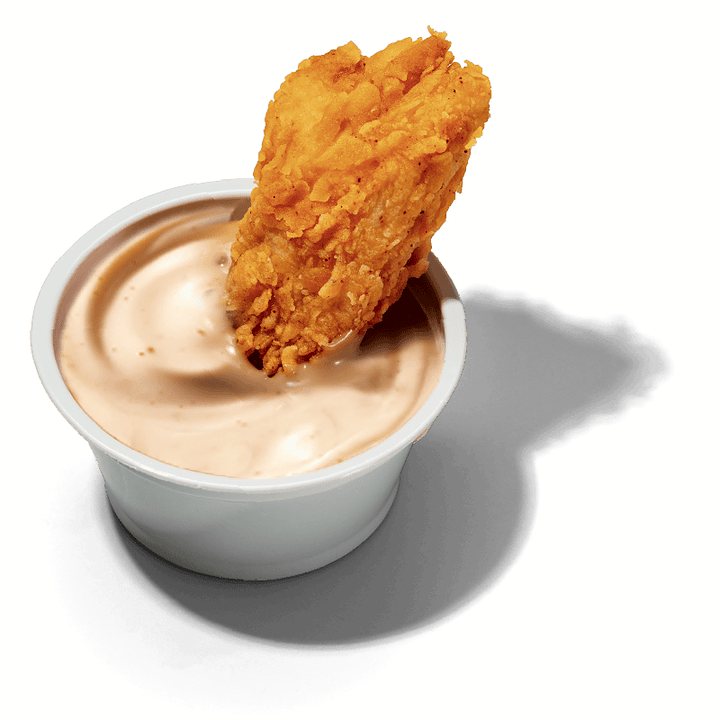 Pote de molho Louisiana Soul com um pedaço de frango empanado